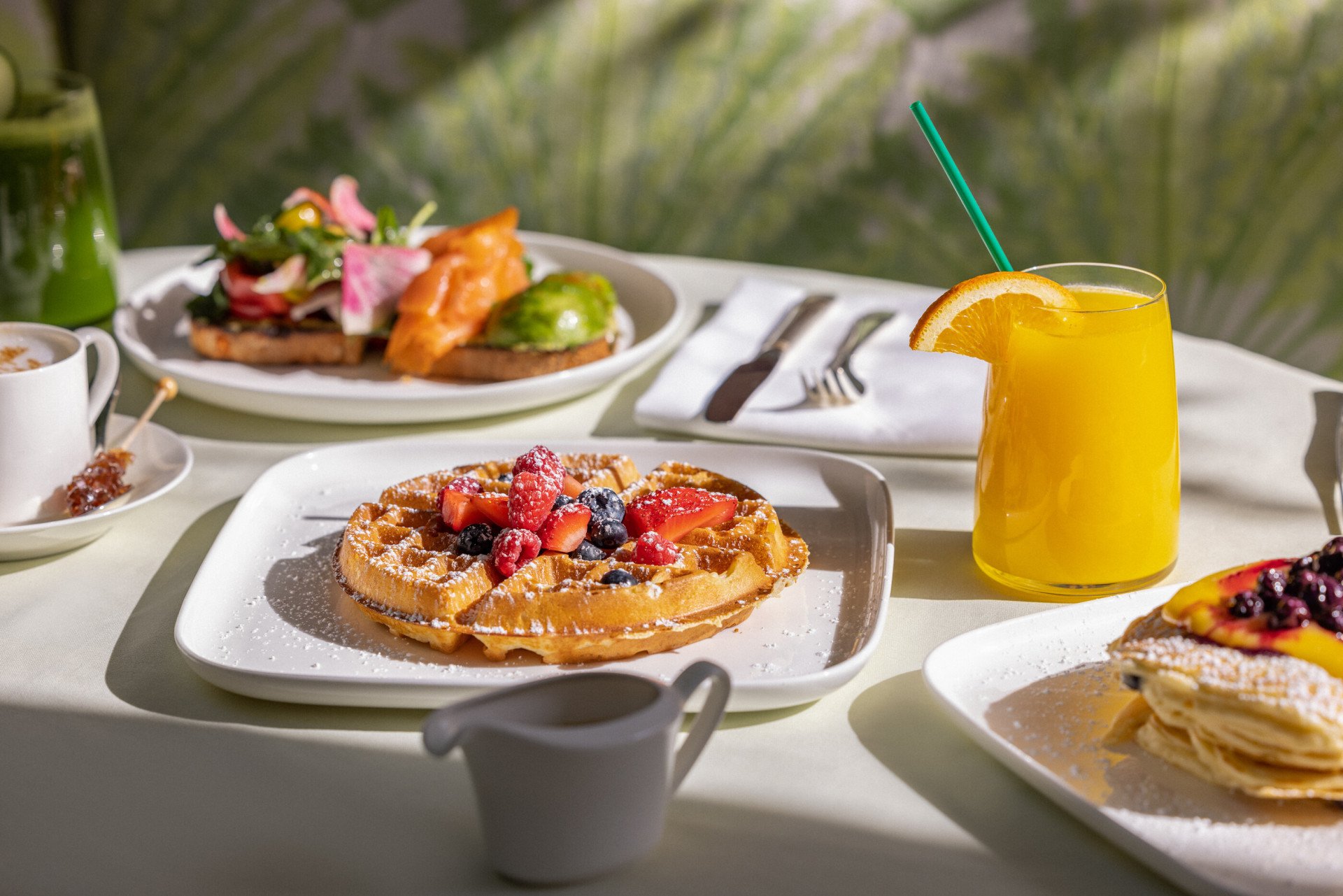 Breakfast spread featuring waffles in Polo Lounge at The Beverly Hills Hotel 