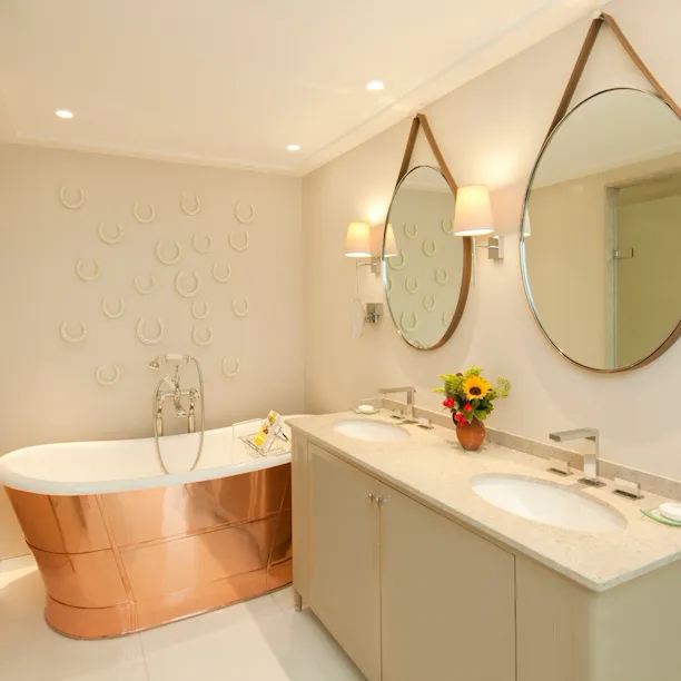 Stable Deluxe room bathroom interior at Coworth Park, Ascot