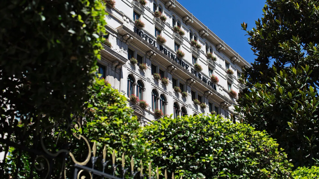 Exterior of Hotel Principe Di Savoia from ground level on a sunny day, Milan