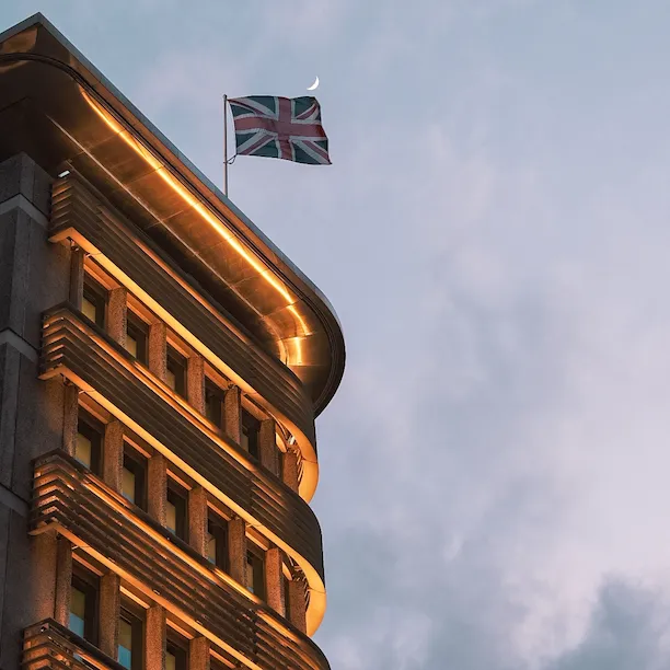 Exterior of hotel lit up at dusk - 45 Park Lane. 5 Star Hotel in Mayfair