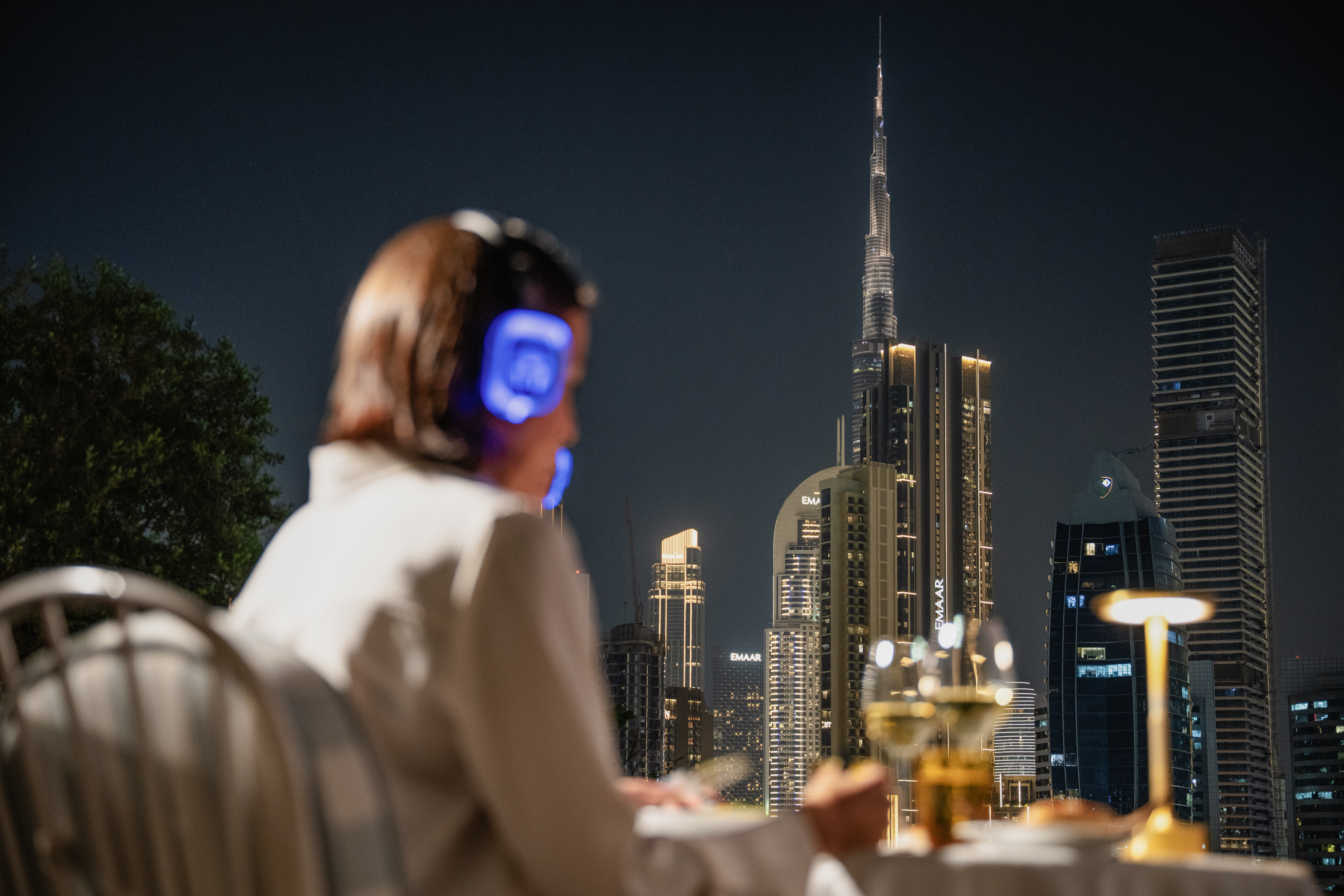 Guests enjoying the Riviera Cinema club experience with the views of Burj Khalifa in the back