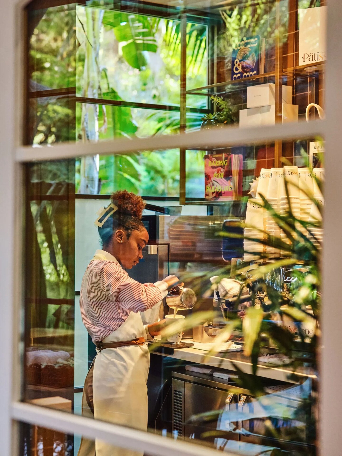 Barista pouring coffee in The Patisserie 