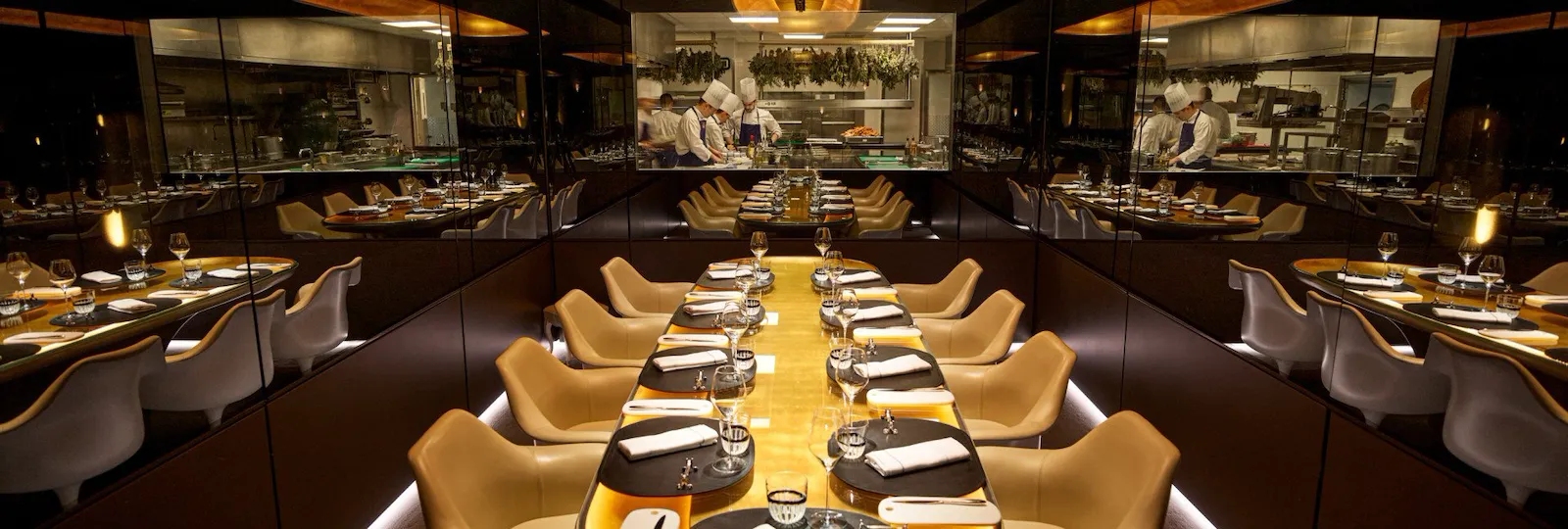 Large view of the Chef's Table with the window open on the kitchen at Le Meurice, Paris - Dorchester Collection