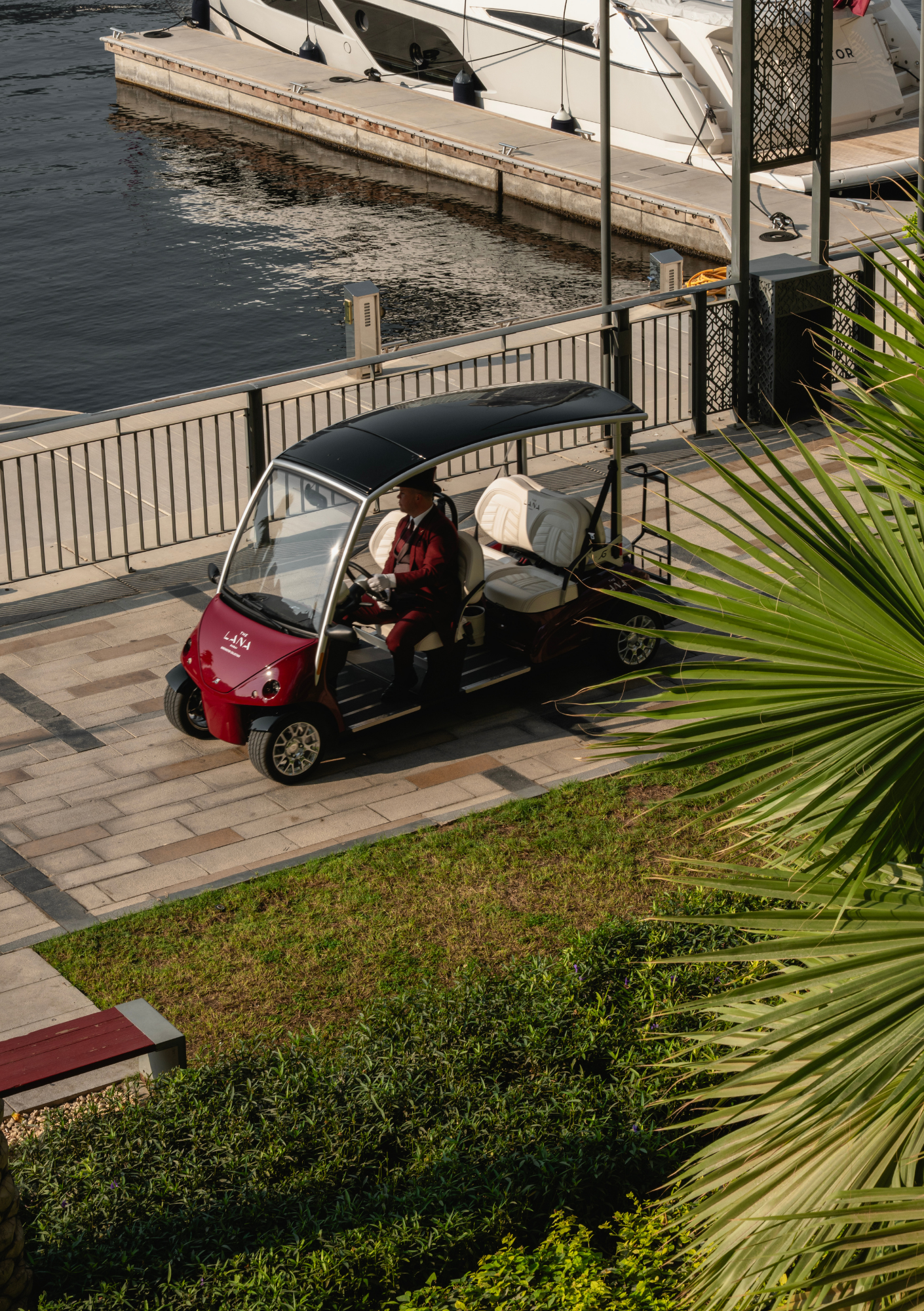 The Lana's golf cart passing in front of the marina. 