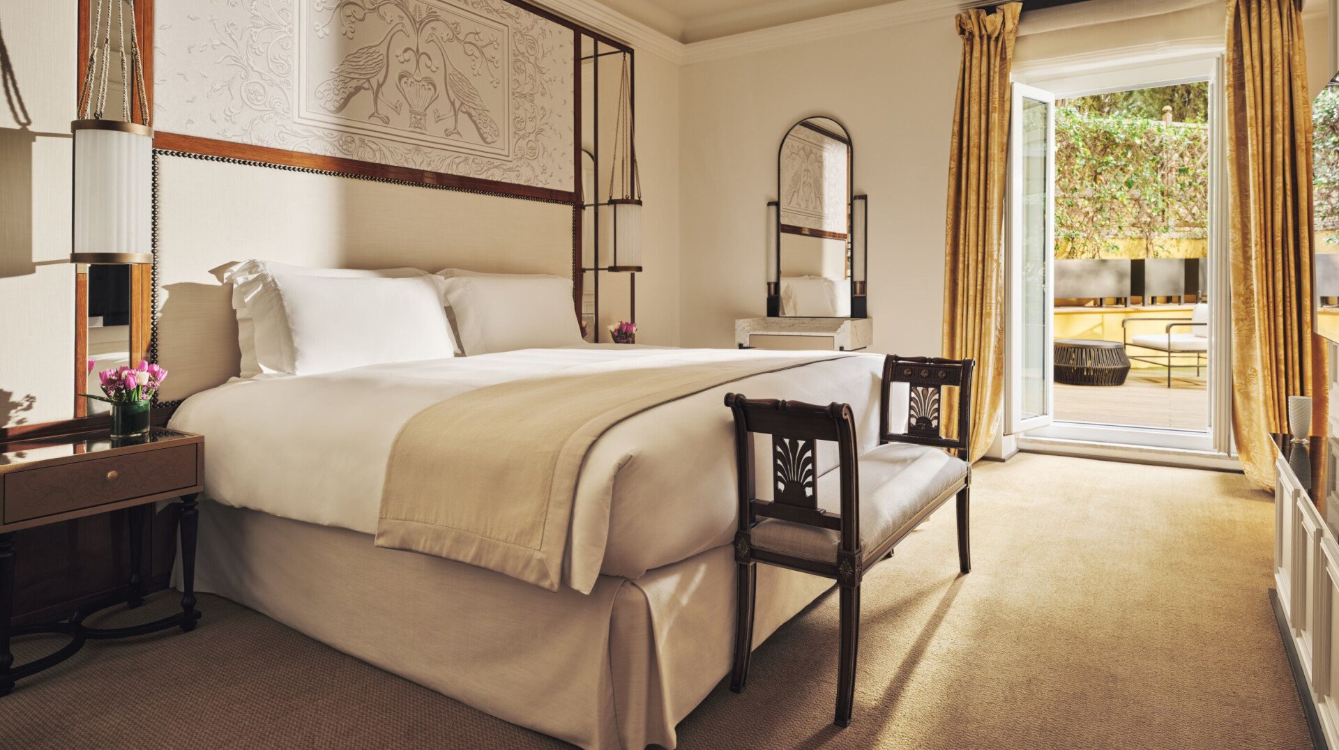 Aurora Terrace Suite bedroom with open window onto private terrace