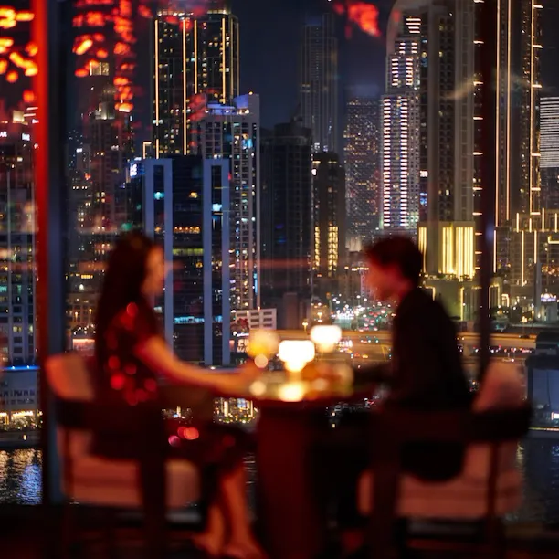 A couple enjoying drinks at Jara by Martin Berasategui