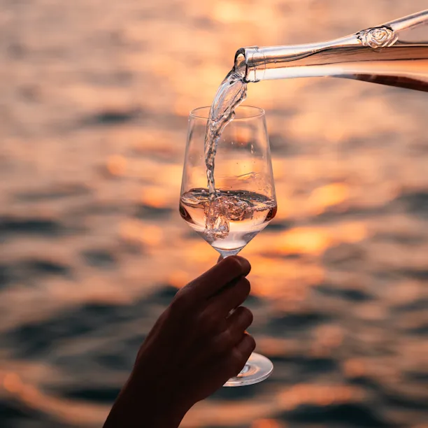 Wine pouring during Sunset