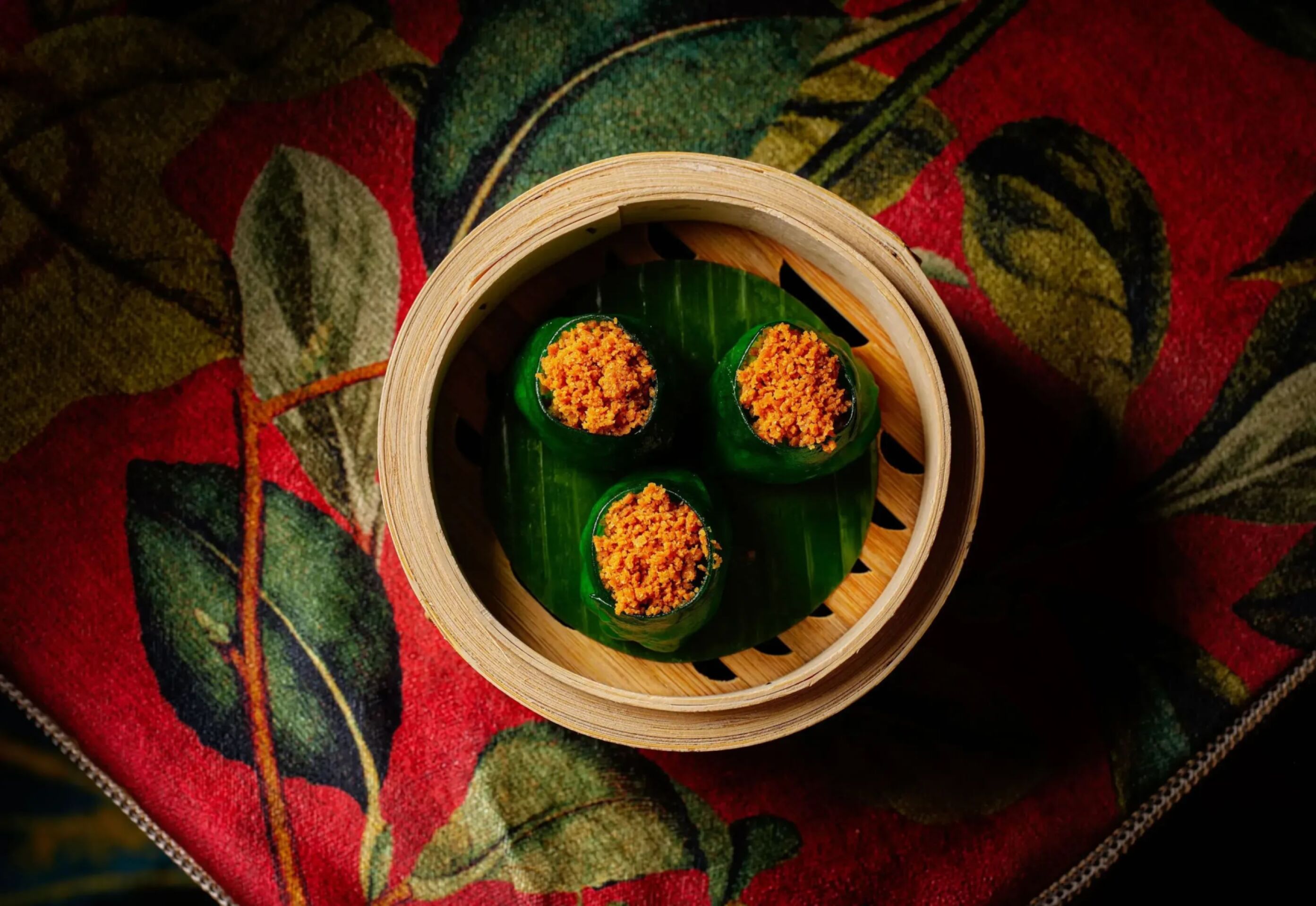 Food dish at China Tang at The Dorchester in soft lighting. Vibrant ingredients 