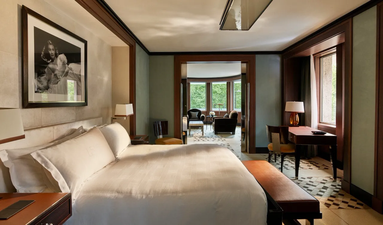 Park suite bedroom showing wrap around living room at 45 Park Lane, London