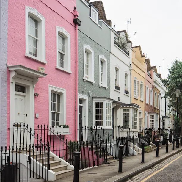 Coloured terrace houses on a street in Bywater Street in Primrose Hill, London