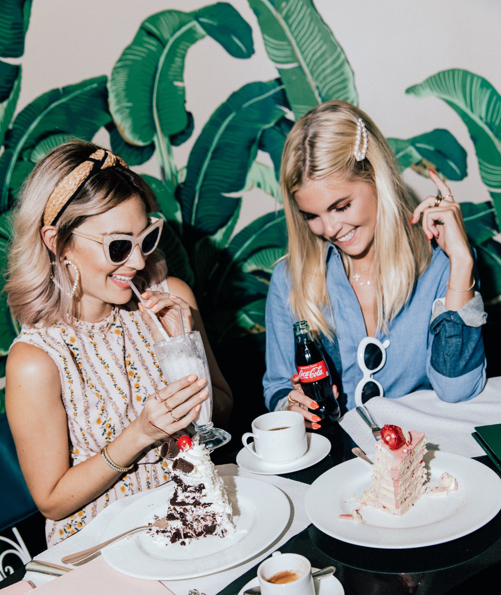 Friends eating cake and drinking milkshakes in The Fountain Coffee Room 