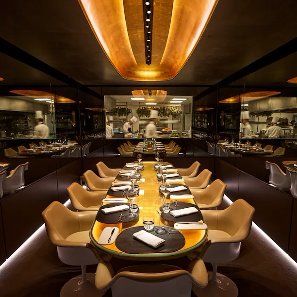 Large view of the Chef's Table with open window on the kitchen at Le Meurice, Paris - Dorchester Collection