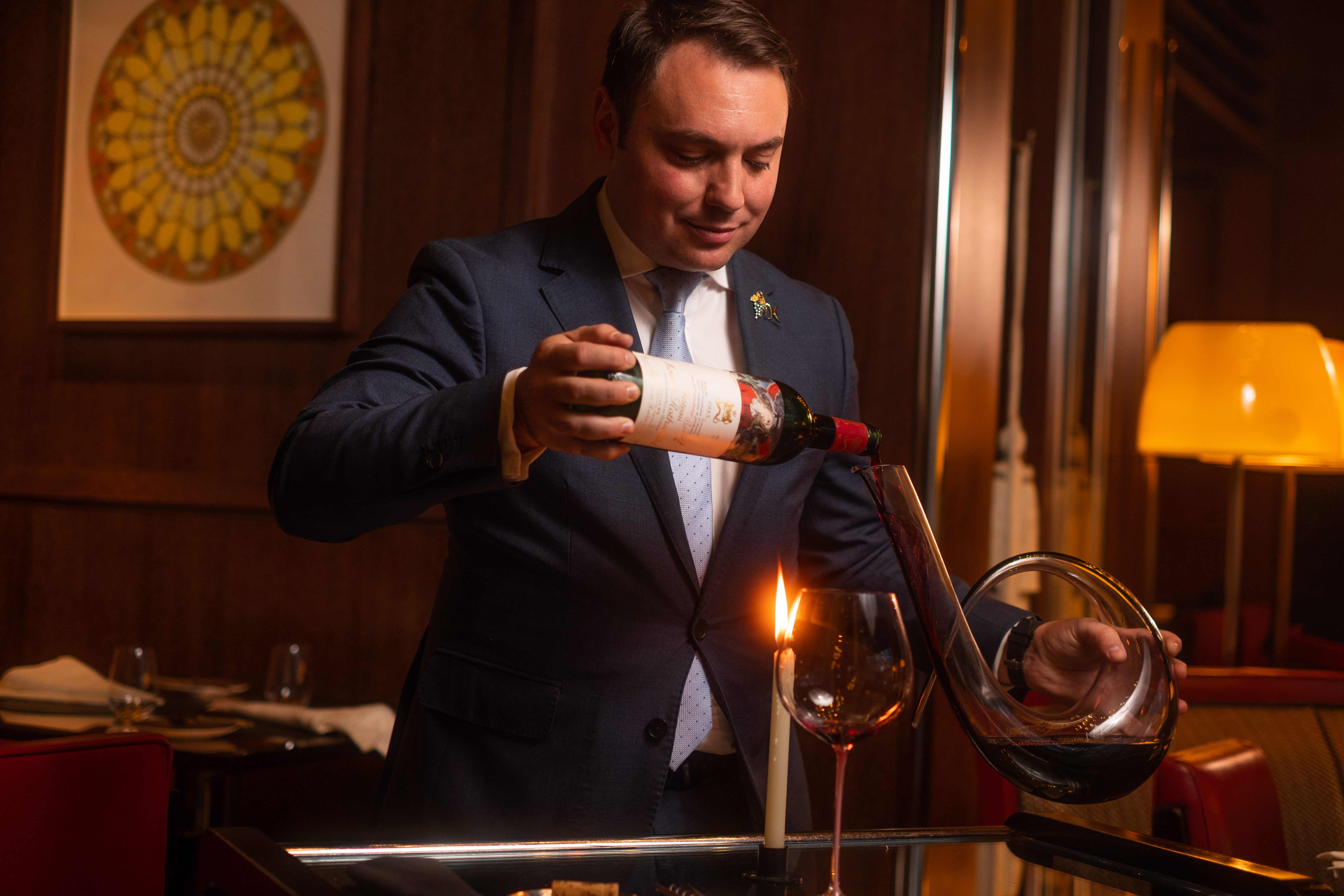 Staff photo of Davide pouring wine in CUT at 45 Park Lane