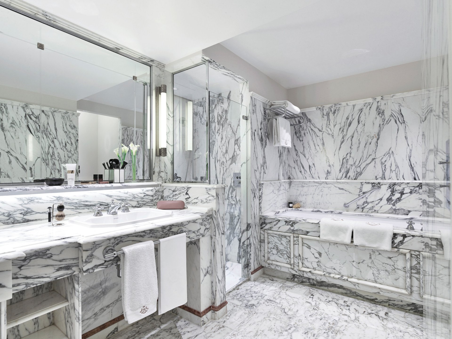 Marble bathroom of a deluxe room with a bathtub, at Le Meurice, Paris.