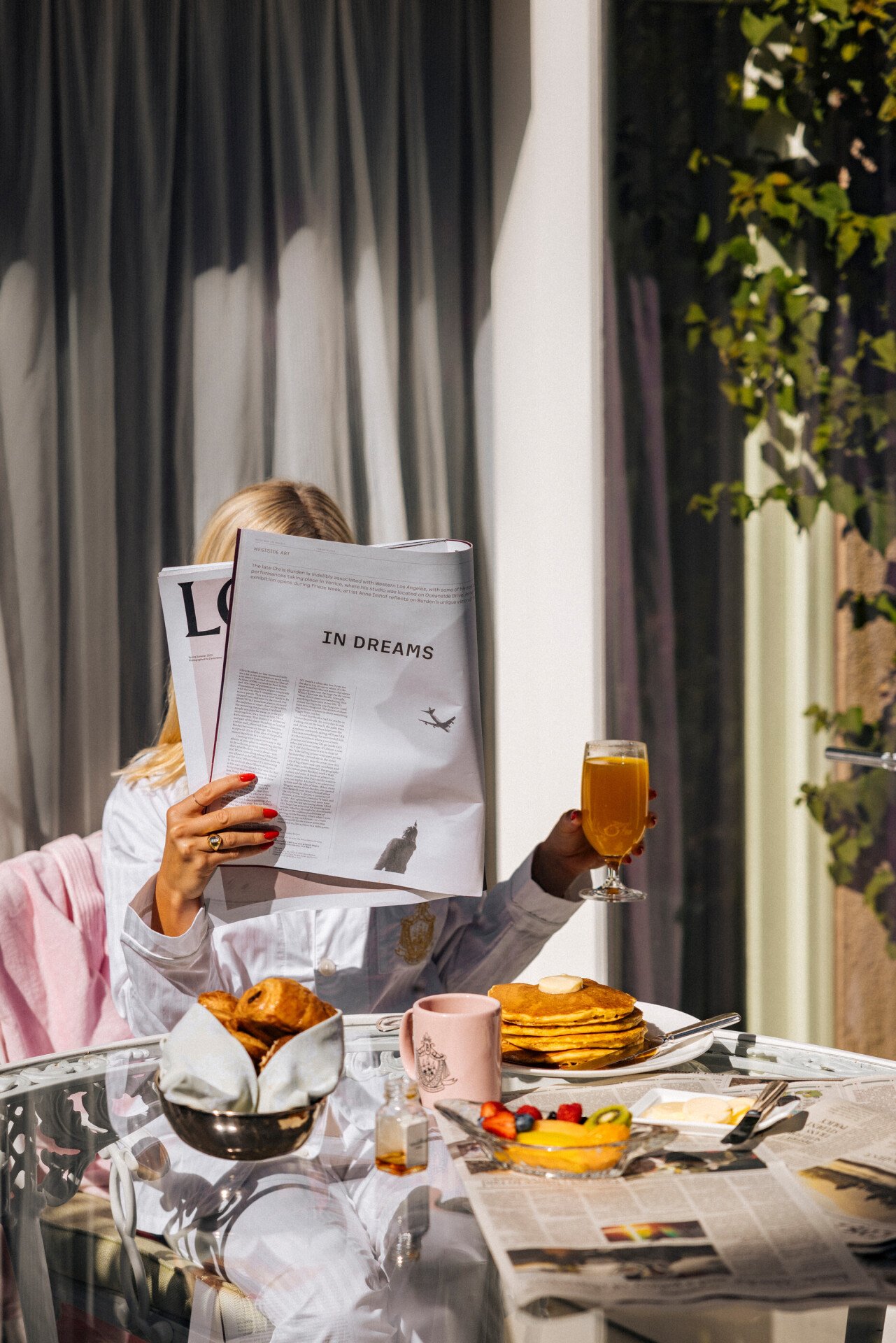 model enjoying room service on the patio 