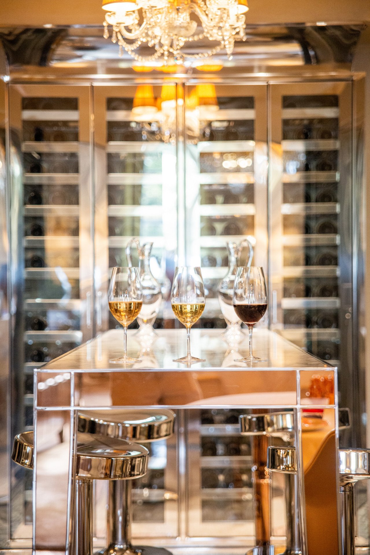 Three glasses of white and red wines in the wine cellar of Restaurant Le Meurice Alain Ducasse, at Le Meurice, Paris.