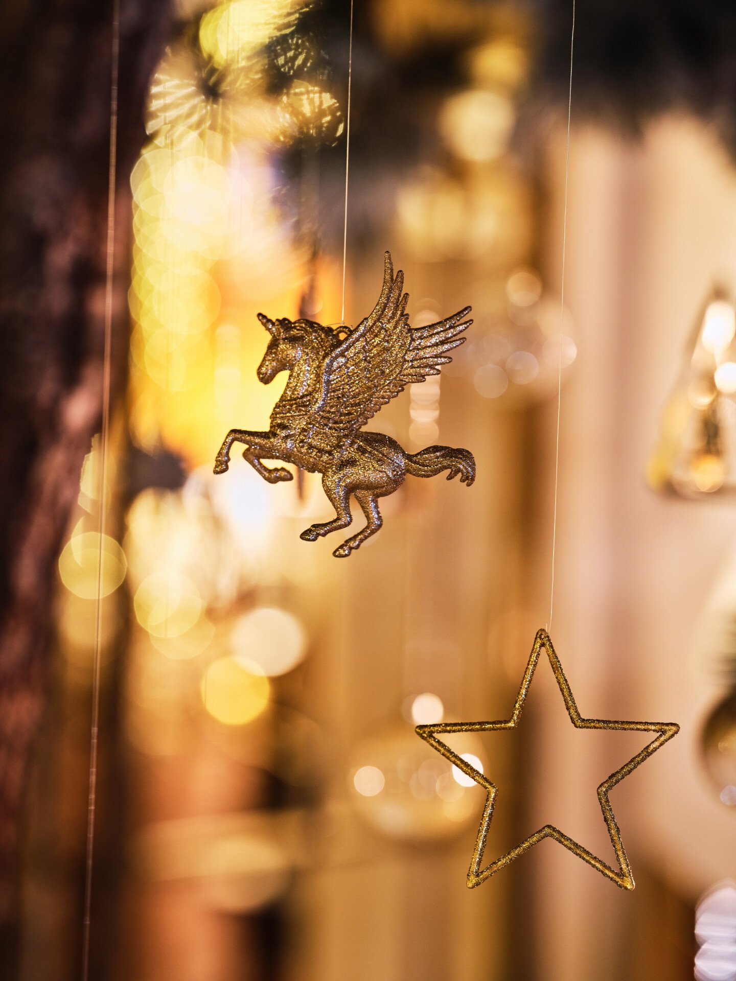 Zoom on Christmas decorations hooked on a Christmas tree, at Le Meurice, Paris