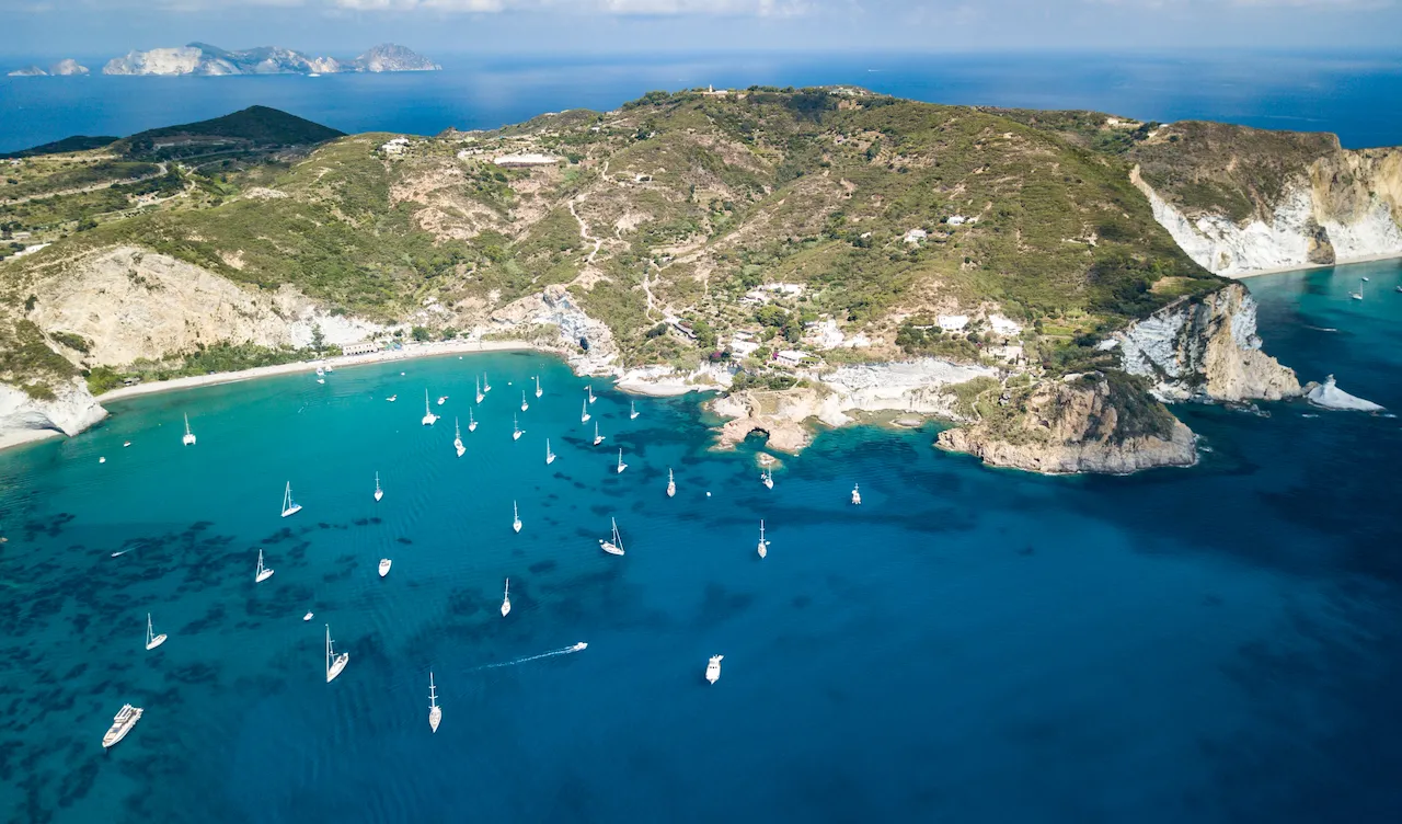Aerial view of Palmarola island with many boats in the water