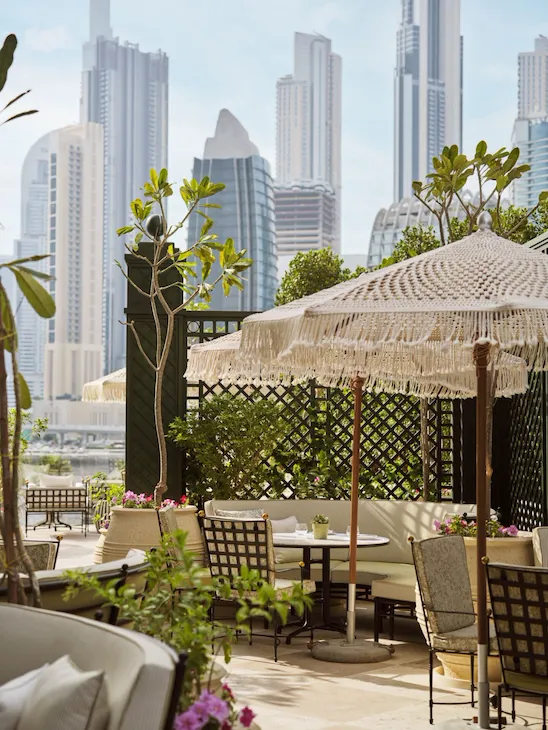 Image of Veranda design and food at The Lana - Dorchester Collection