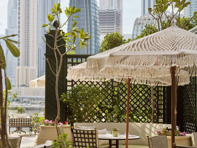 Image of Veranda design and food at The Lana - Dorchester Collection