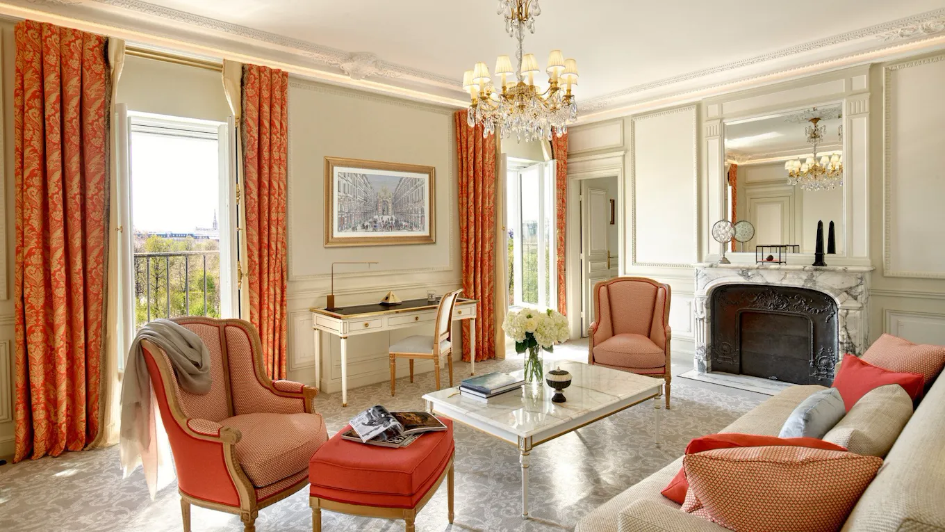 Executive suite living room with open doors to Tuileries garden view at Le Meurice, Paris