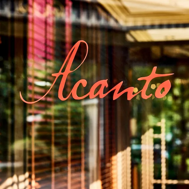 View of Acanto restaurant external door with Acanto sign in red