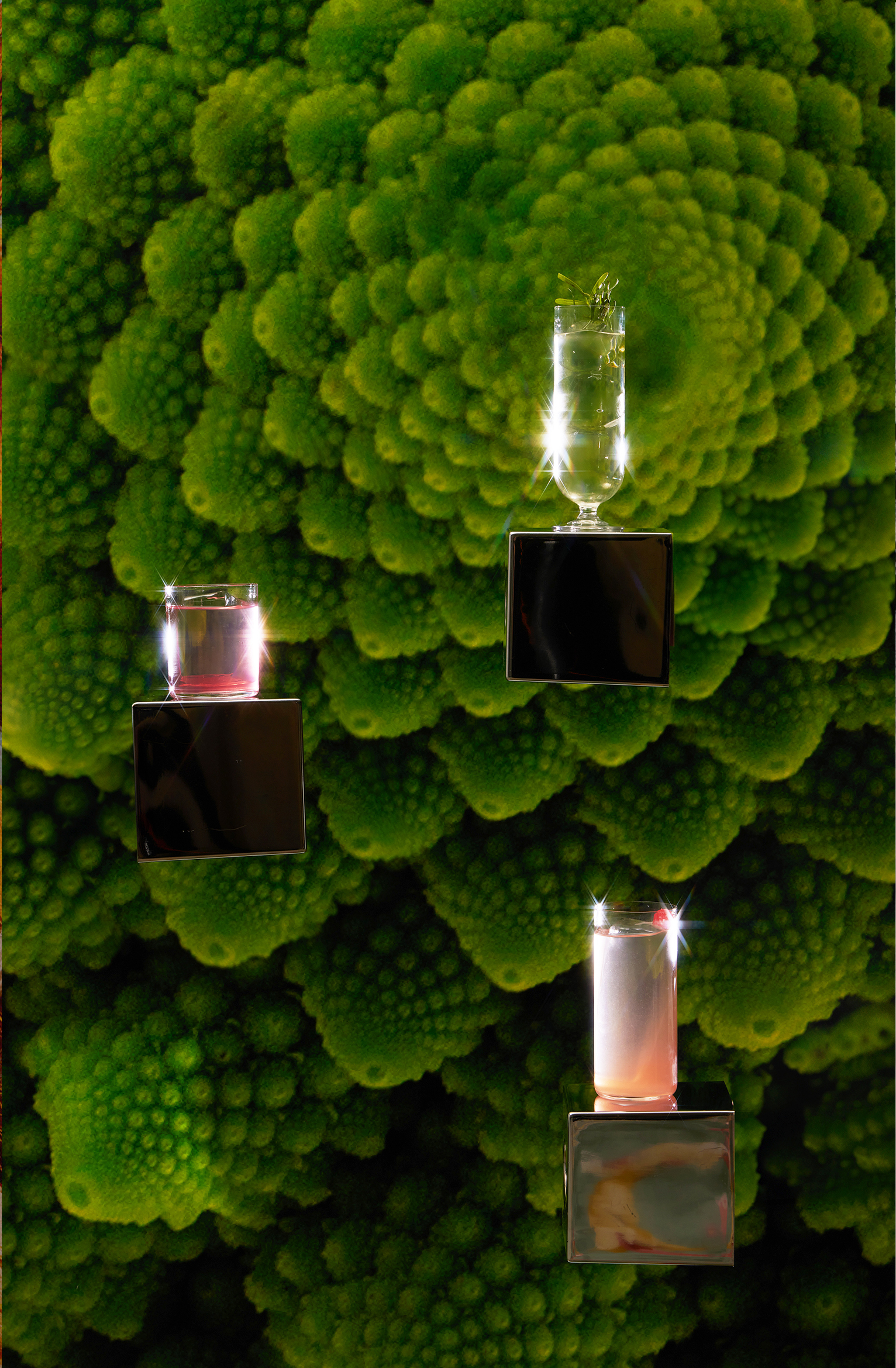 The Dorchester Vesper Bar Eterna Menu cocktails floating on silver boxes with green plant background