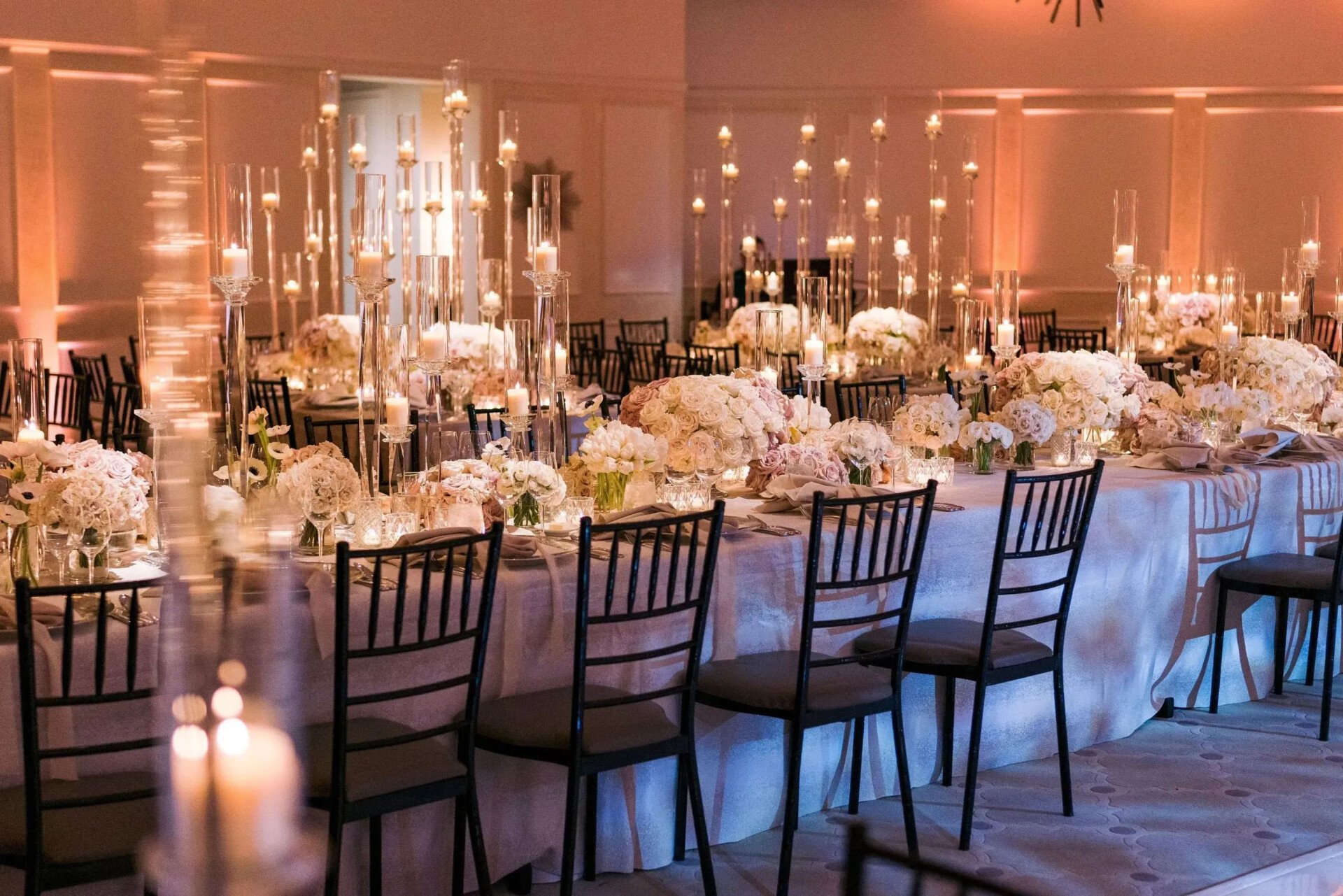Garden ballroom décor with tall glass vases for wedding 