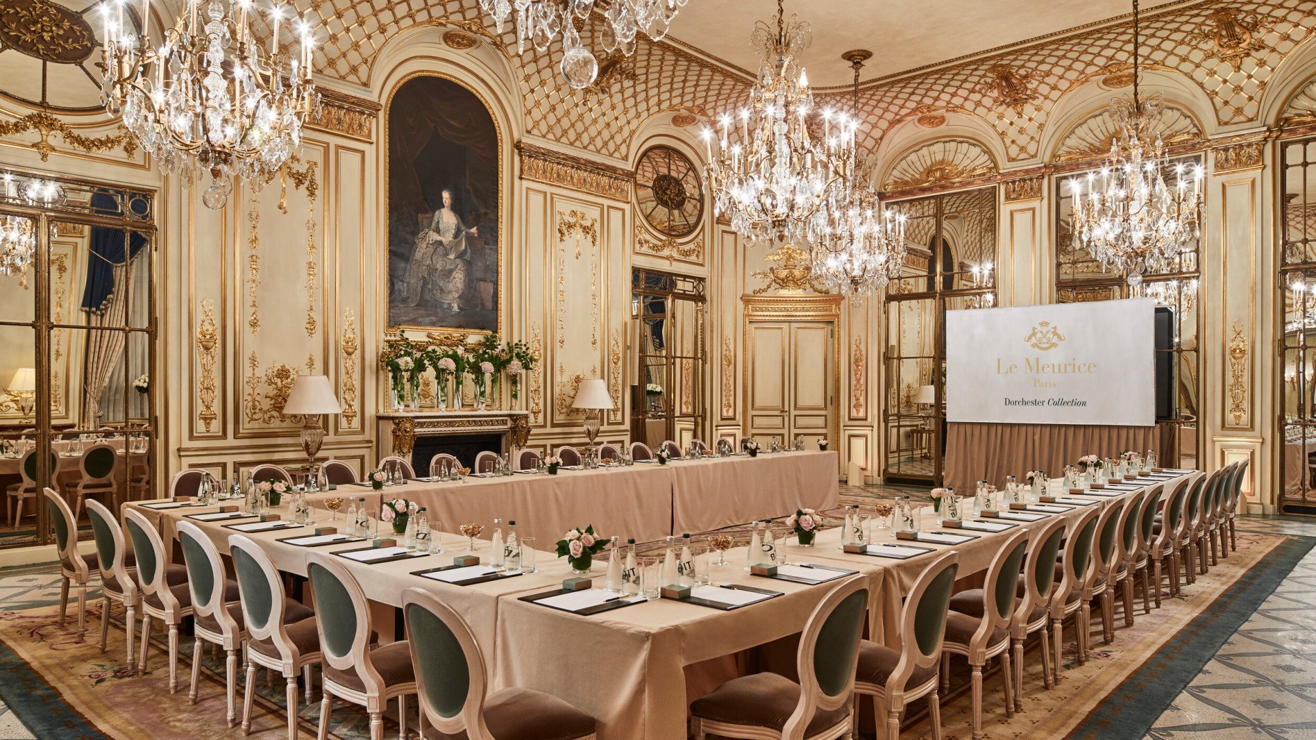 Salon Pompadour at Le Meurice with the classroom configuration including a full screen projector for presentations. 