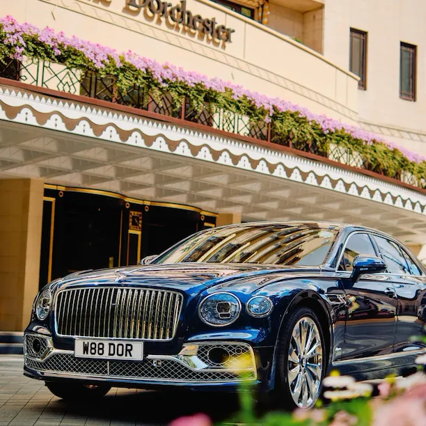 The Dorchester Bentley outside the front of The Dorchester in the sunshine