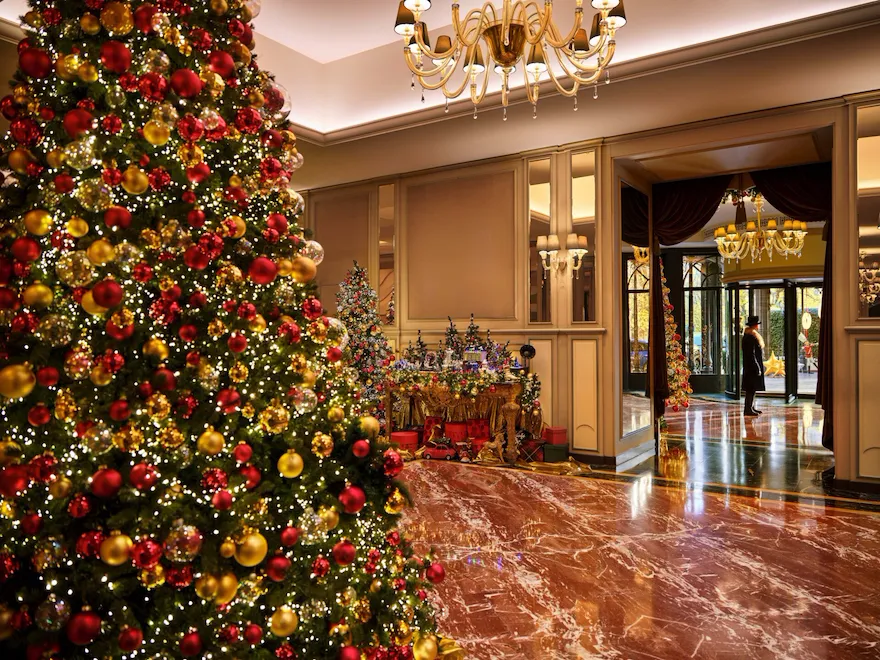 Hotel entrance with festive setup and the doorman in the background