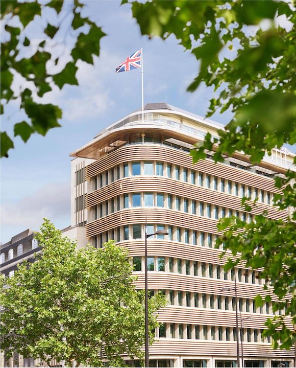 Exterior facade of 45 Park Lane London on a sunny day from Hyde Park, London