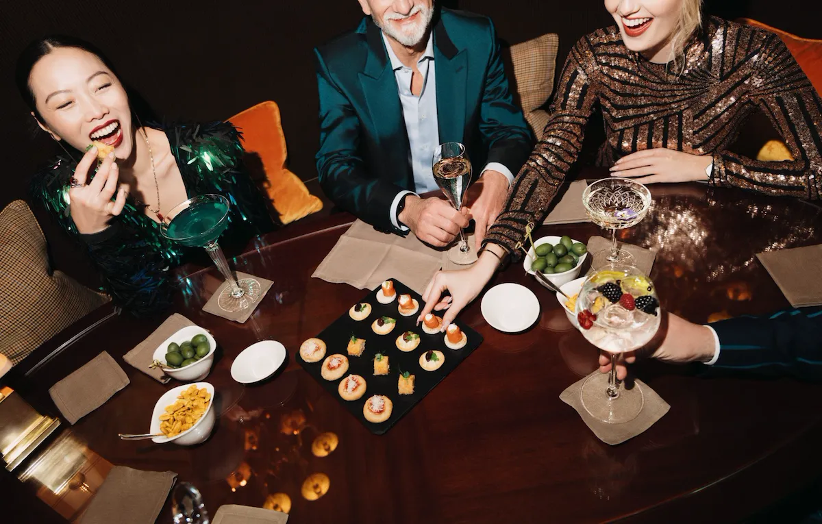 People eating canapes and drinking cocktails at Principe Bar