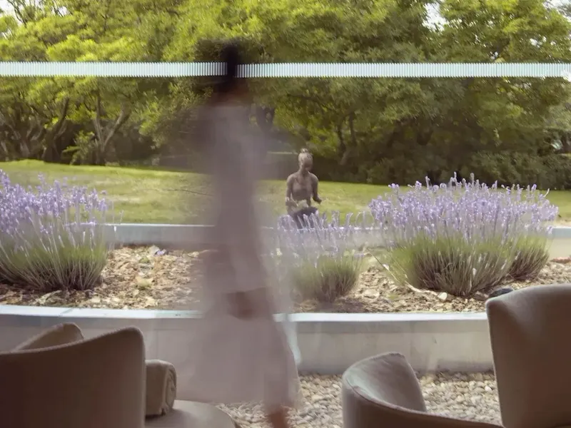 Model walking through relaxation room at The Spa at Coworth Park