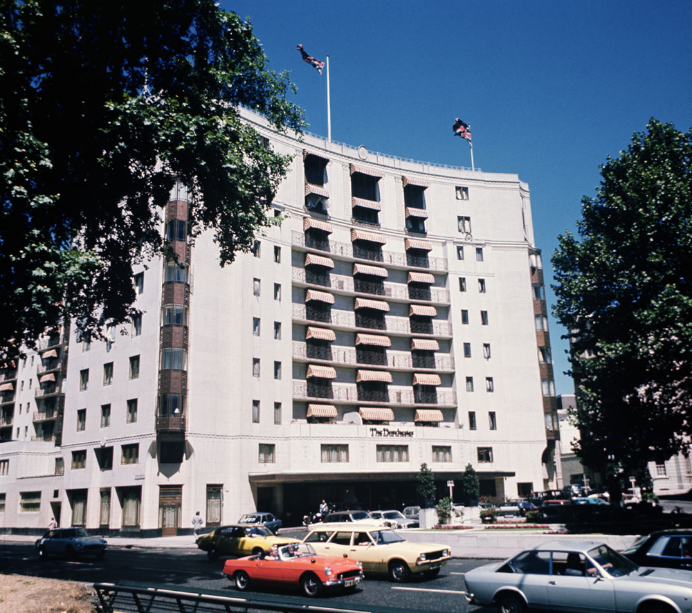 View of The Dorchester facade and forcourt from Park Lane in daylight