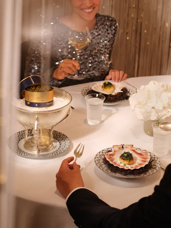 Couple dining at Alain Ducasse at The Dorchester, London