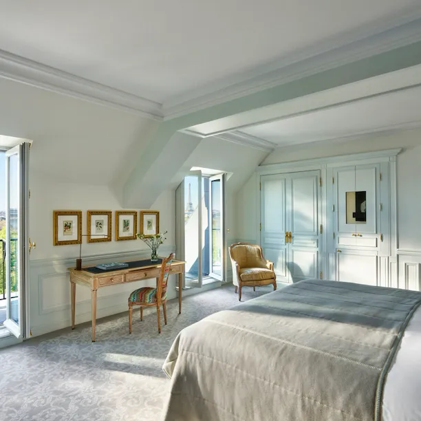 Executive room with balcony doors open to a view of the Tuileries gardens at Le Meurice, Paris