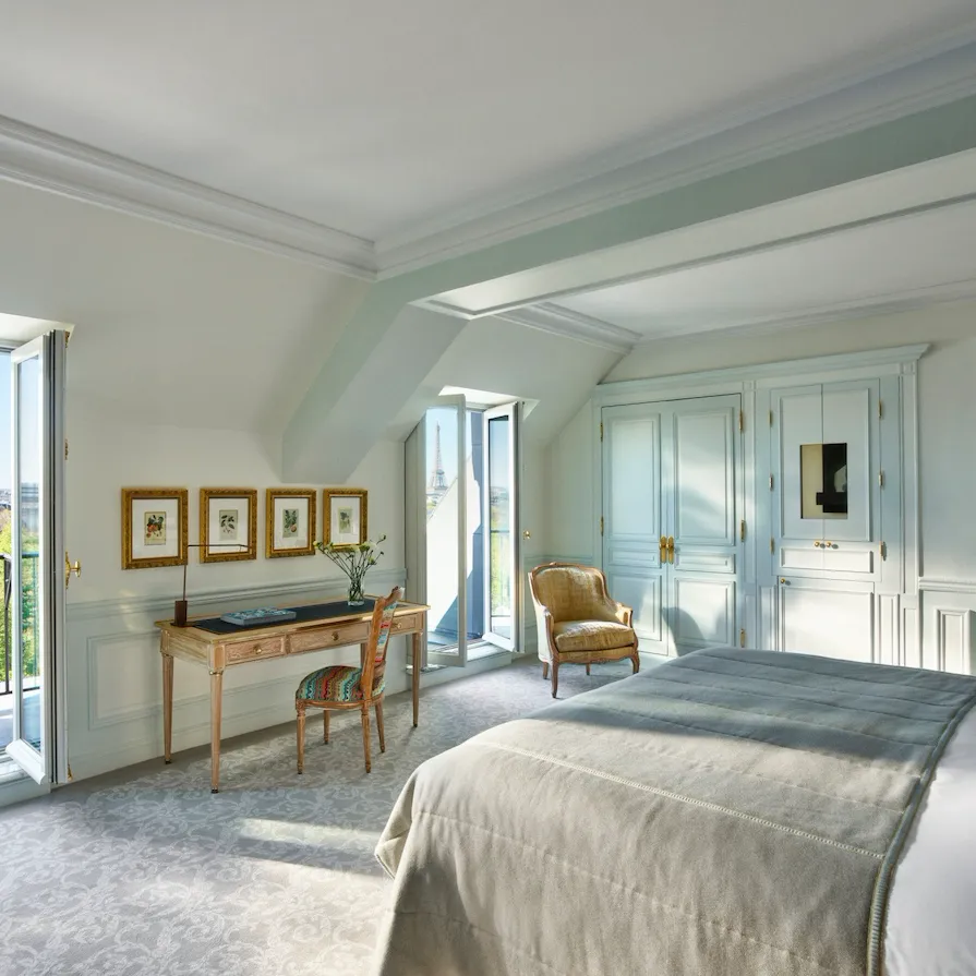 Executive room with balcony doors open to a view of the Tuileries gardens at Le Meurice, Paris