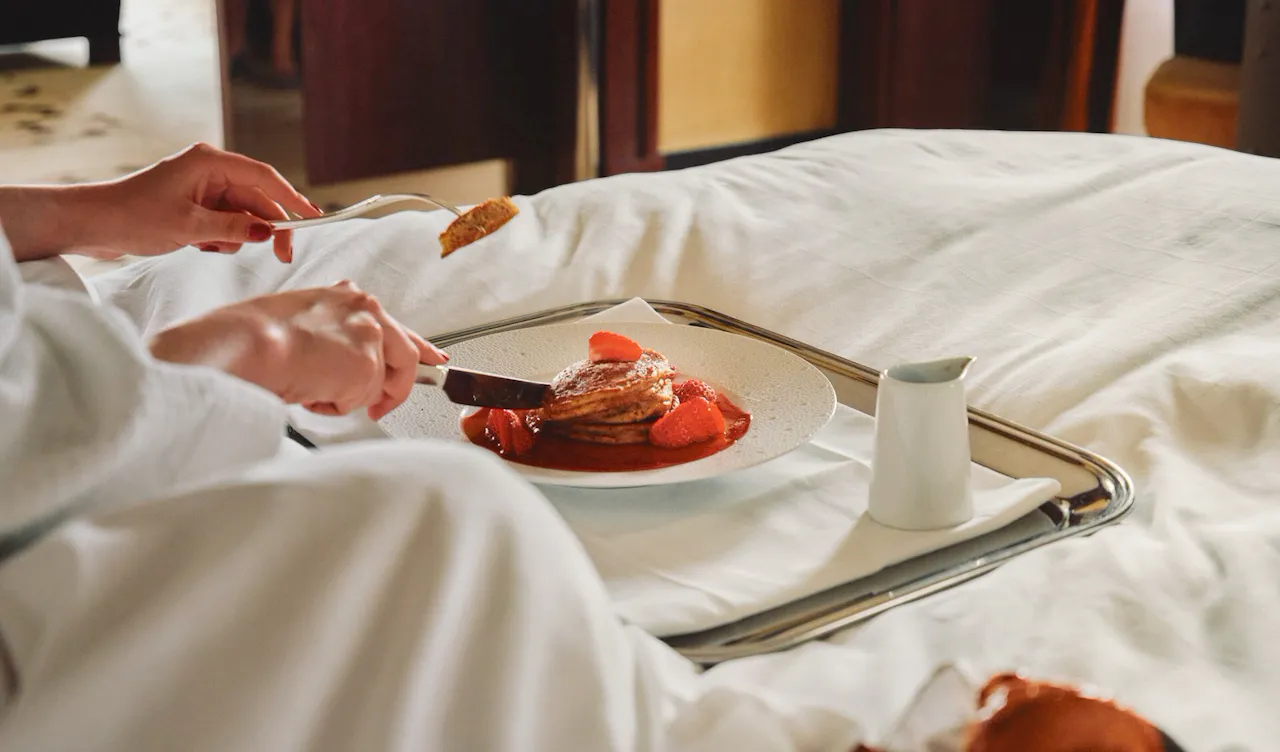 Woman looking out window of Park Lane Studio