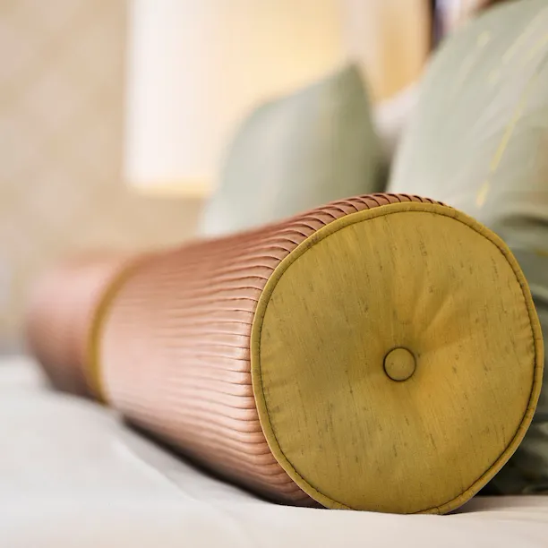 Detail photo of bed pillows in Bungalow Suite, The Beverly Hills Hotel