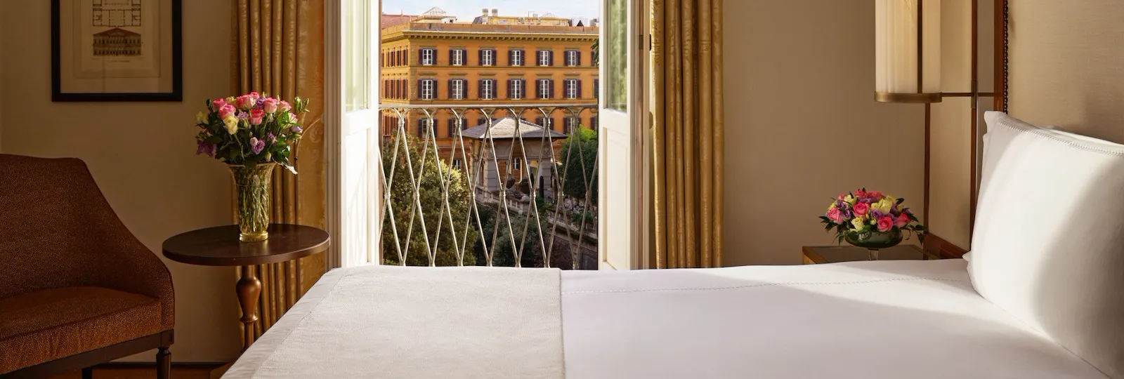 Bedroom of classic room with view, with open window looking at via Ludovisi, Hotel Eden, Rome