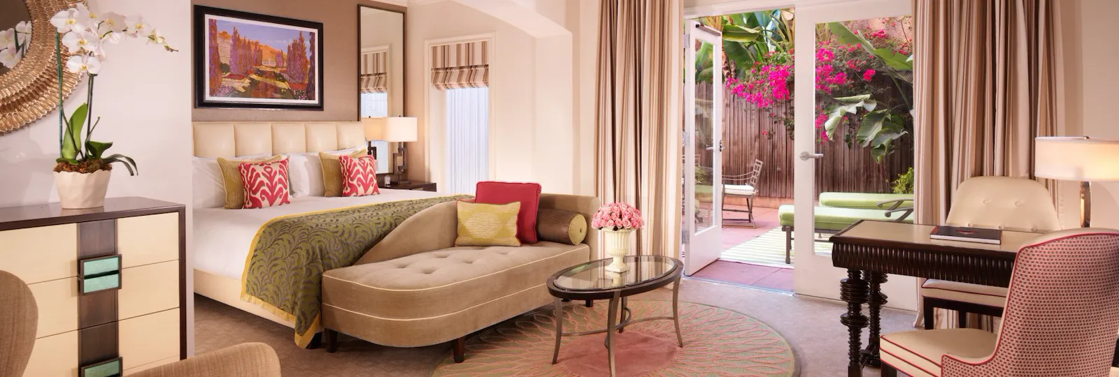 Deluxe guestroom with patio, desk and seating area