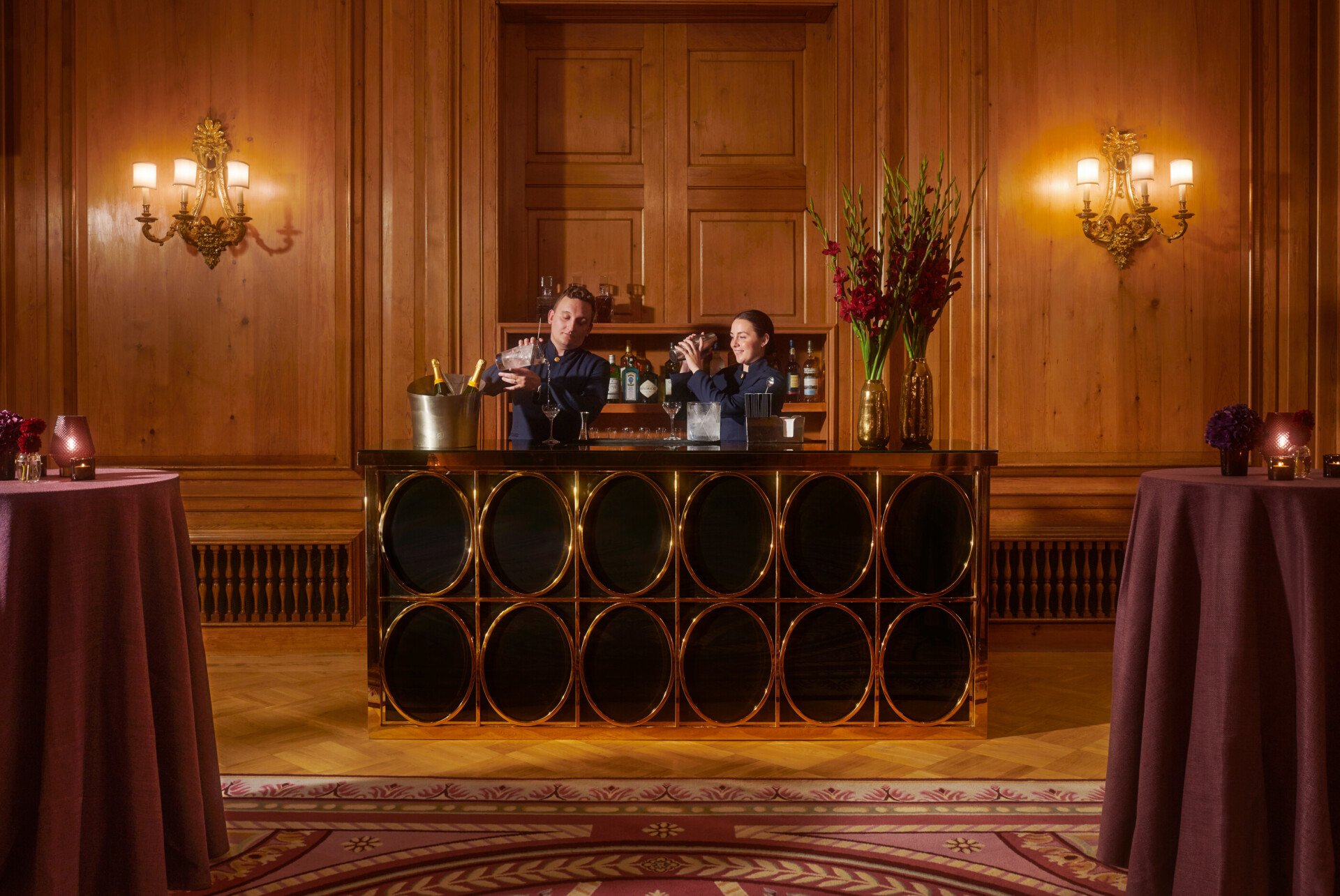 The Holford Room Event space at The Dorchester set up for cocktail reception with bar tenders at the bar.