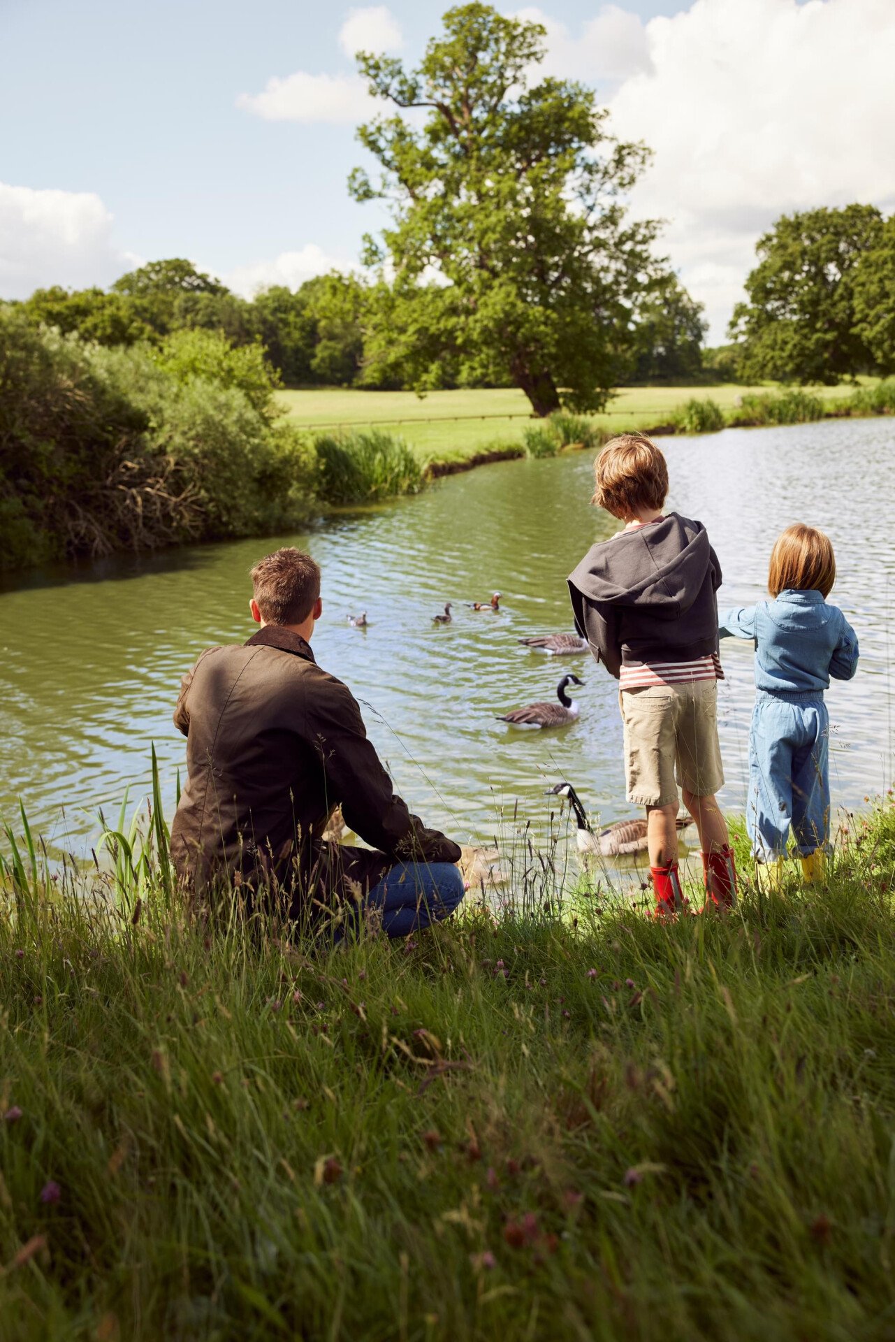 Family enjoying a walk beside the Coworh Park  lake