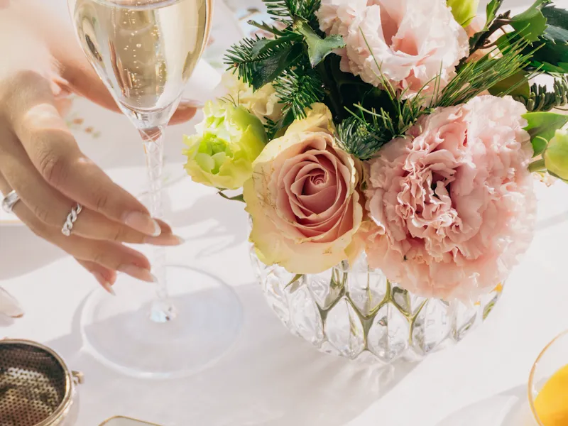 A close up at a champagne glass and sandwiches in The Gallery