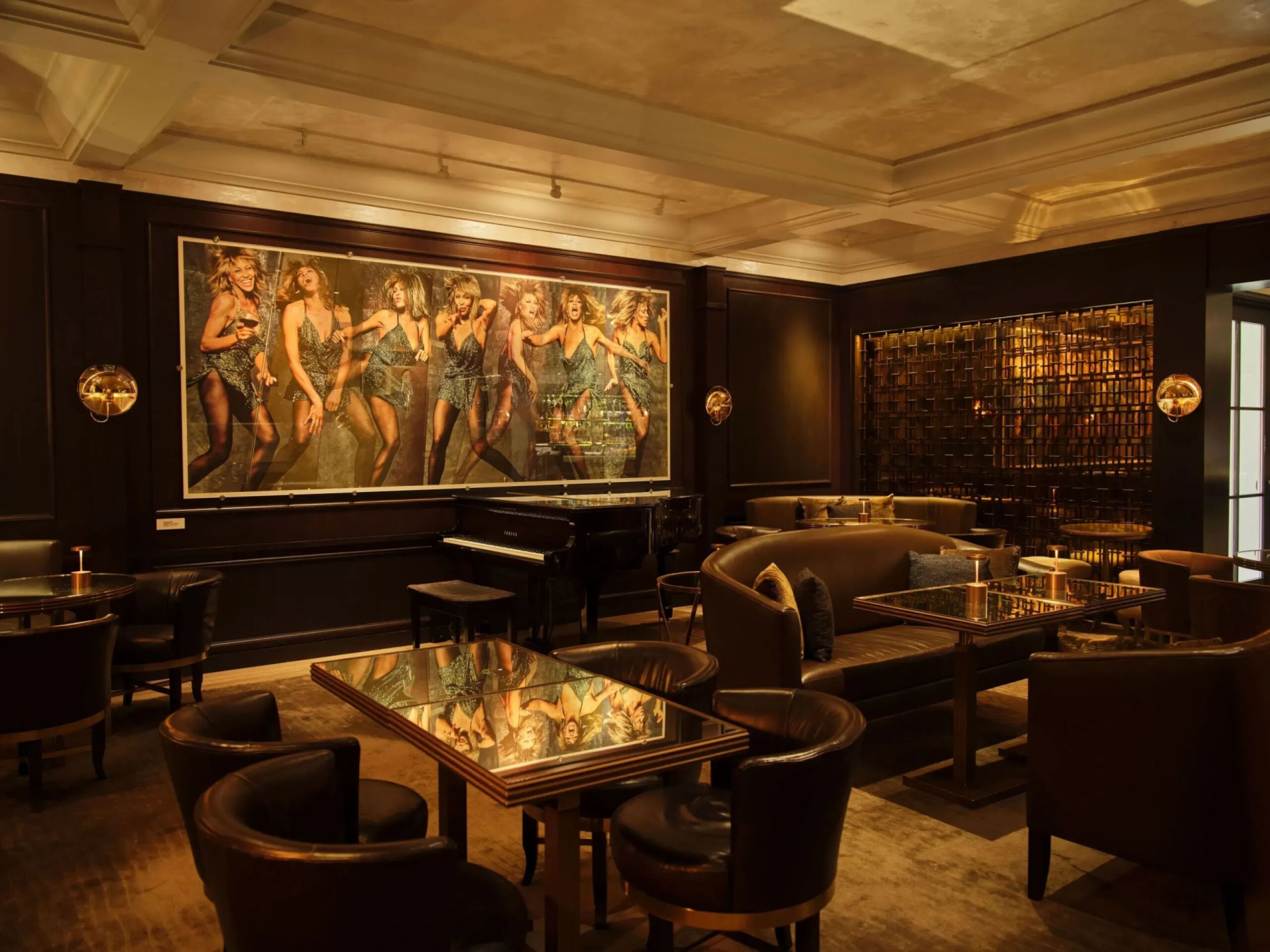The bar and Lounge wide view with color Tina Turner portrait  