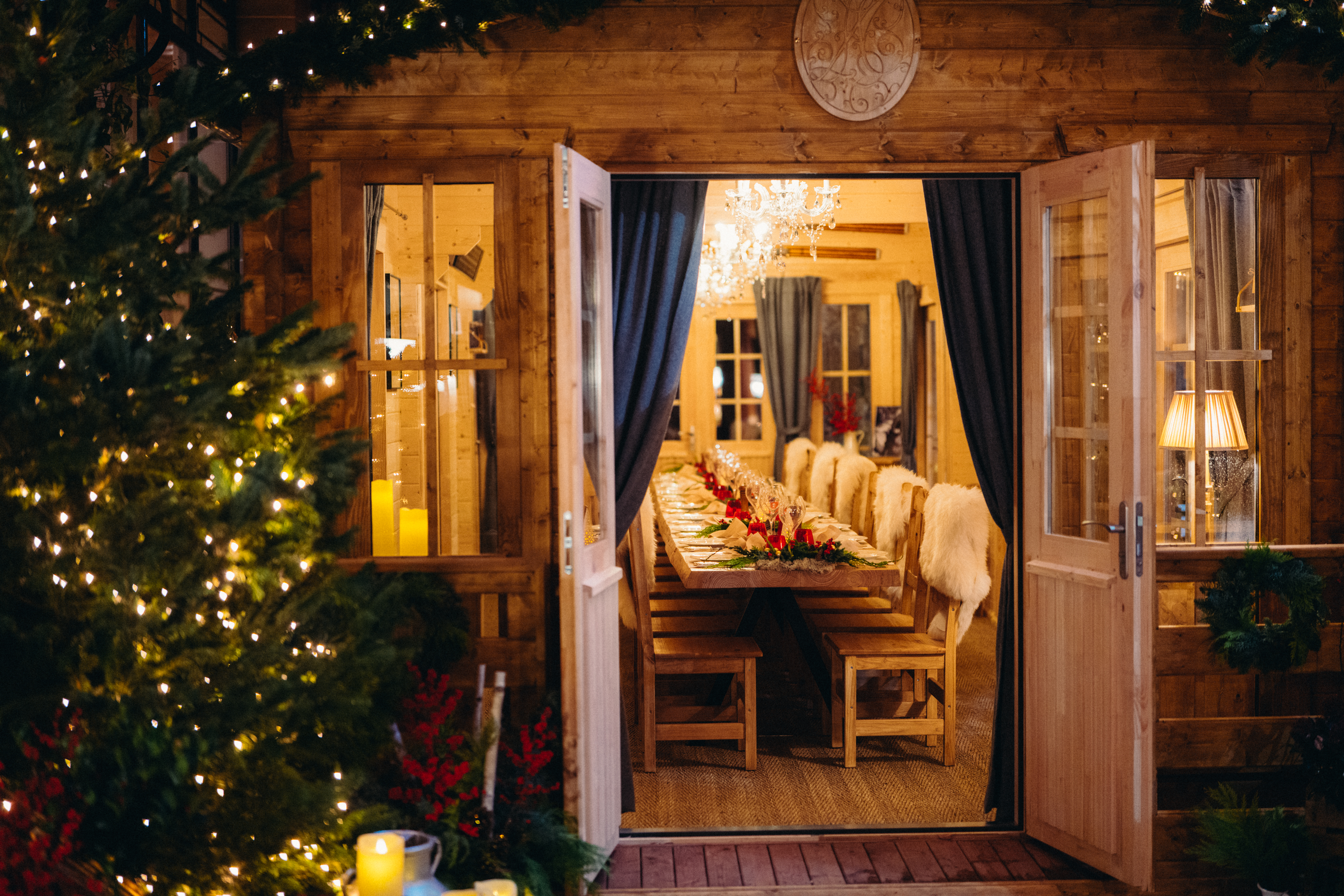 Le Chalet du Plaza Athenee showing en open door to a dressed wooden table and chairs