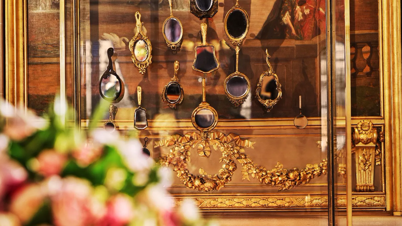 Golden details and mirrors in the fireplace in the lobby at Le Meurice, Paris - Dorchester Collection