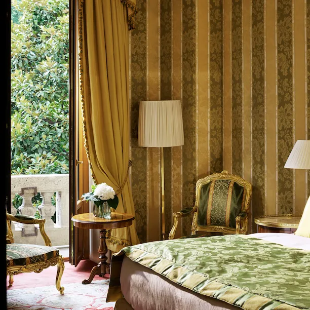 Royal Suite Bedroom Detail of the yellow and green wallpaper matching with the bed decorations