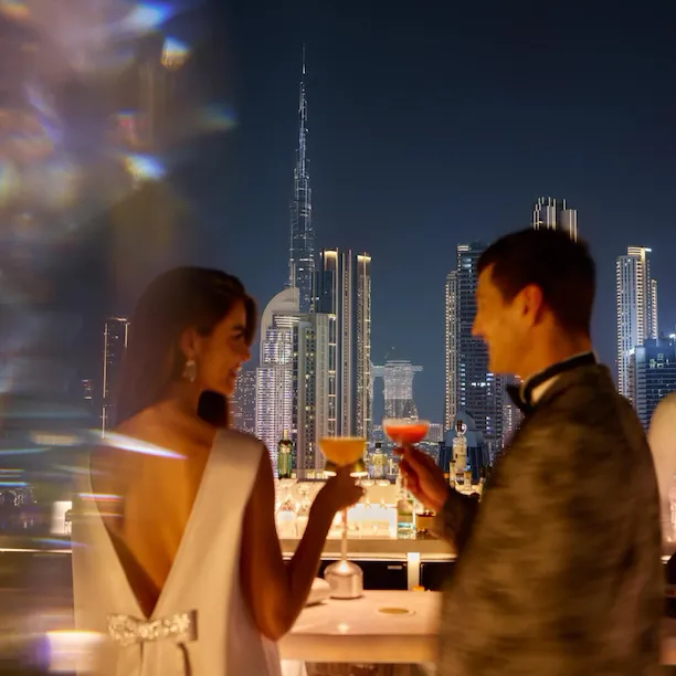 A couple enjoying drinks at High Society